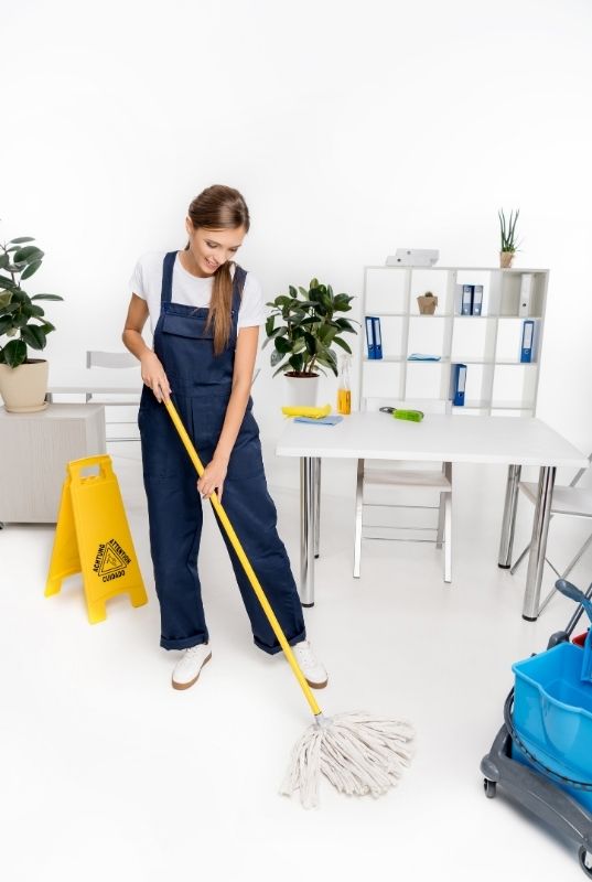 Person Cleaning and mopping floor in an office