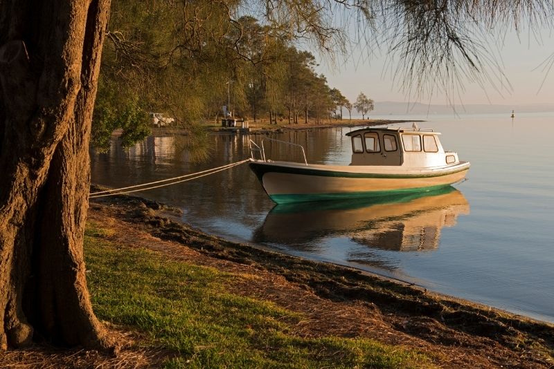 Twilight at Toronto suburb, Lake Macquarie. The is a boat moored on the bank