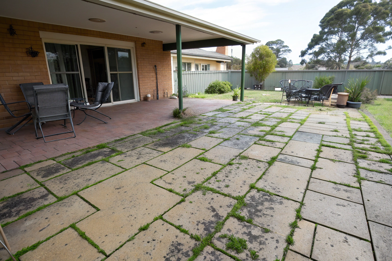algae and mould stained concrete patio Newcastle before pressure cleaning